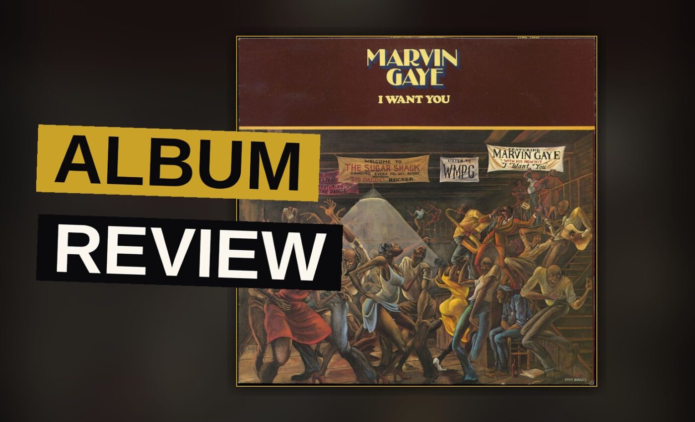 A vinyl record spins on a player in warm, dim lighting, with the sleeve of Marvin Gaye's I Want You partially visible.