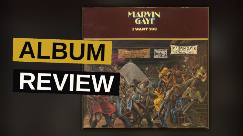 A vinyl record spins on a player in warm, dim lighting, with the sleeve of Marvin Gaye's I Want You partially visible.