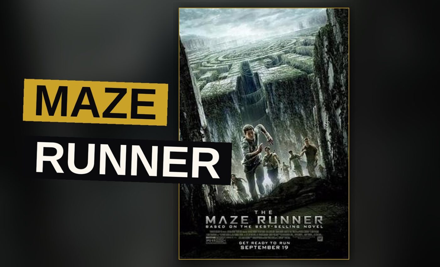A young man in a jacket stands in a grassy stone courtyard, gazing at massive walls opening into a dark maze.