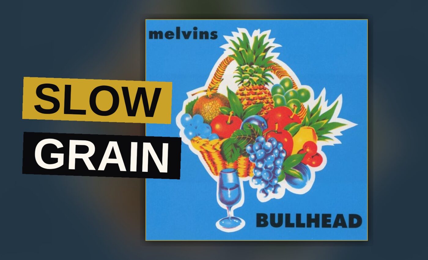 A bulldozer struggles through deep mud, symbolizing the slow, deliberate weight of the record.