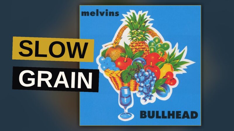 A bulldozer struggles through deep mud, symbolizing the slow, deliberate weight of the record.