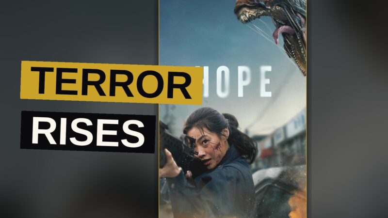 A monster rises above a fishing village called Hope while two officers approach in dread.