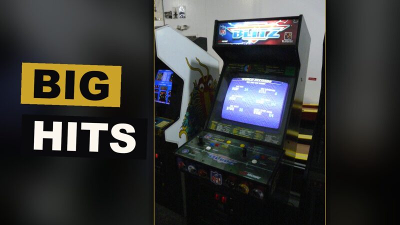 A player delivers a wild, spirited hit upon another during a fast arcade football contest.