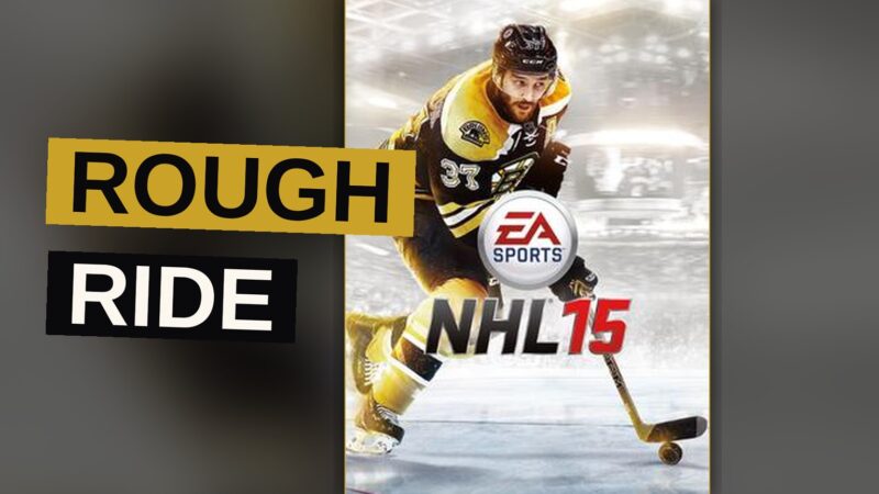 A hockey player makes a hard pass across the ice during a fast-paced match.