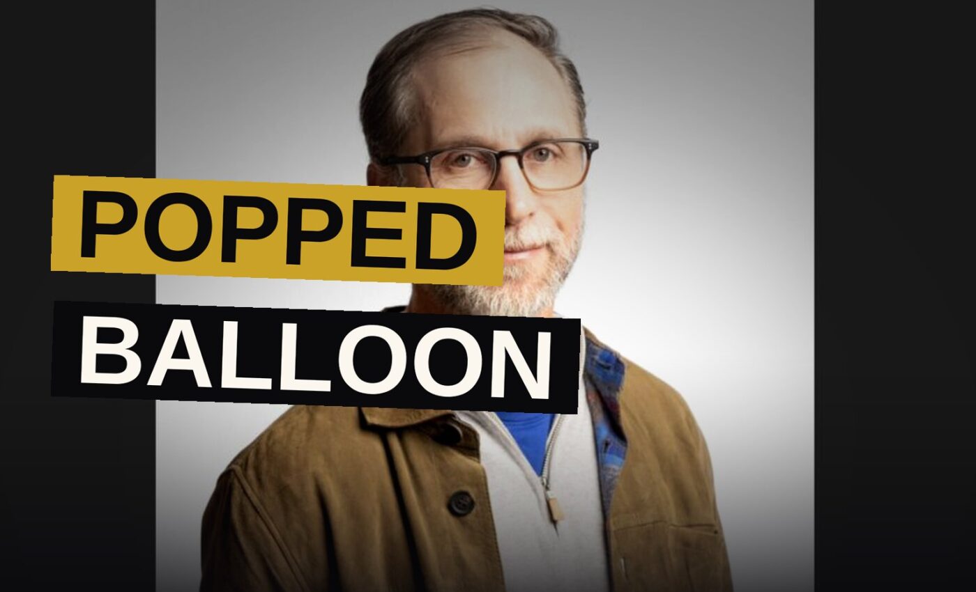 A deflated balloon lies in a hospital hallway, surrounded by empty vials and papers.