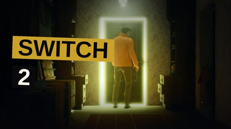 A man holding a glowing handheld console stands in a foggy, dimly lit town street.