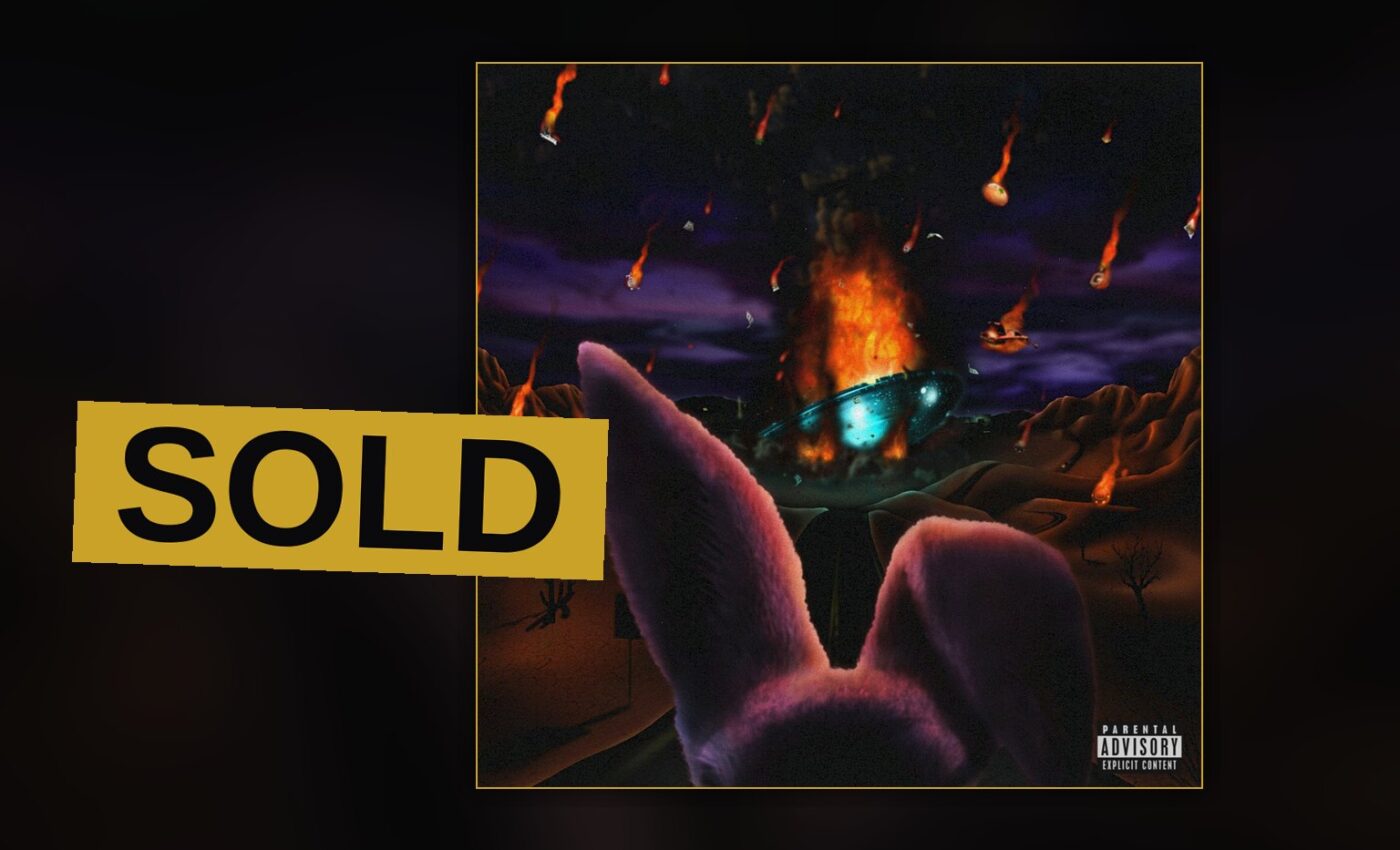 A rapper stands amid smoke and golden light, jewelry catching the glow, in a portrait fit for a costly record.