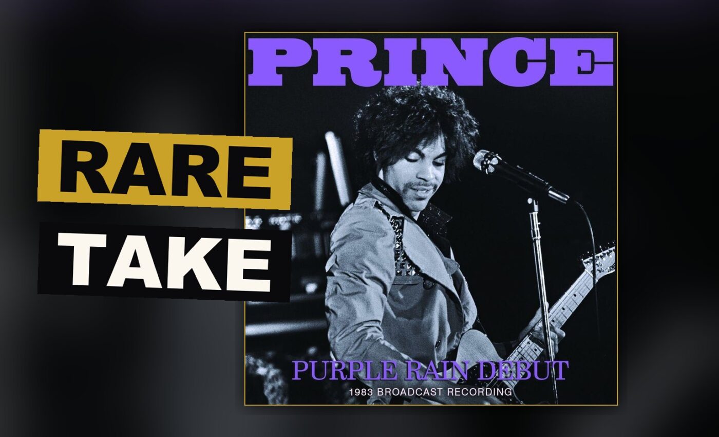 A guitar rests under dim purple light upon an empty stage, as though the band has only just stepped away.