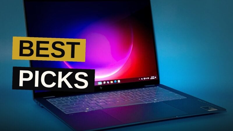 A slim modern laptop displaying a bright screen on a minimalist desk setup.