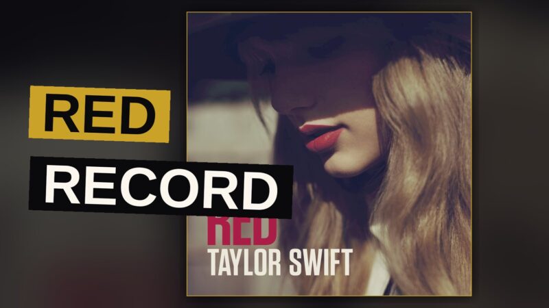 A woman stands bathed in red light, evoking the album's themes of endings and new beginnings.
