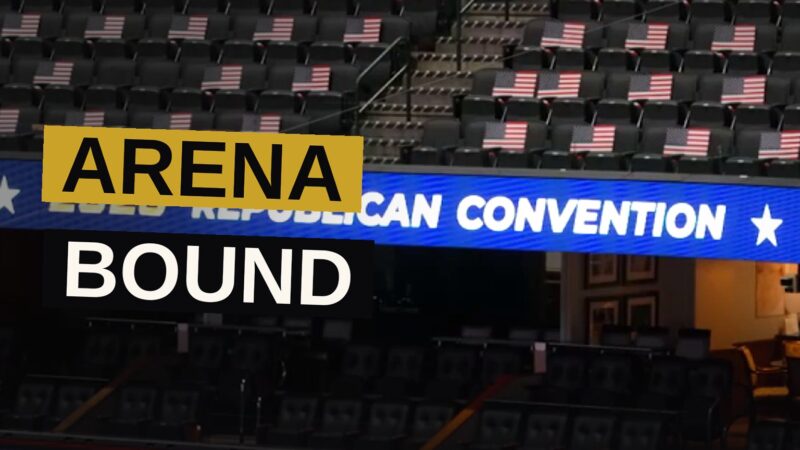 A vast arena filled with a multitude, gazing upon the images of the man who is not, yet ever, upon the ballot.