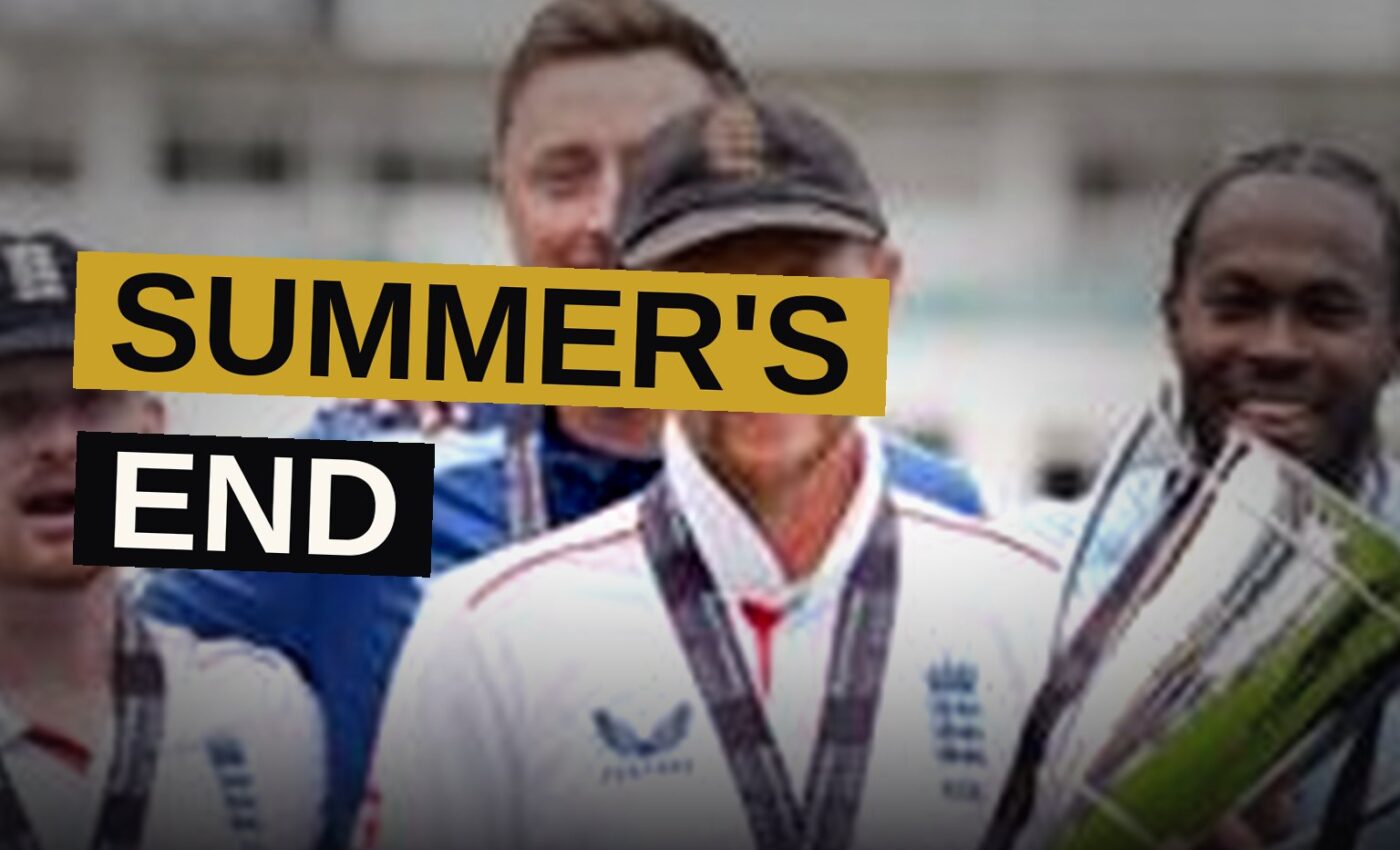 An England cricketer stands alone on a sunlit field at the close of play.