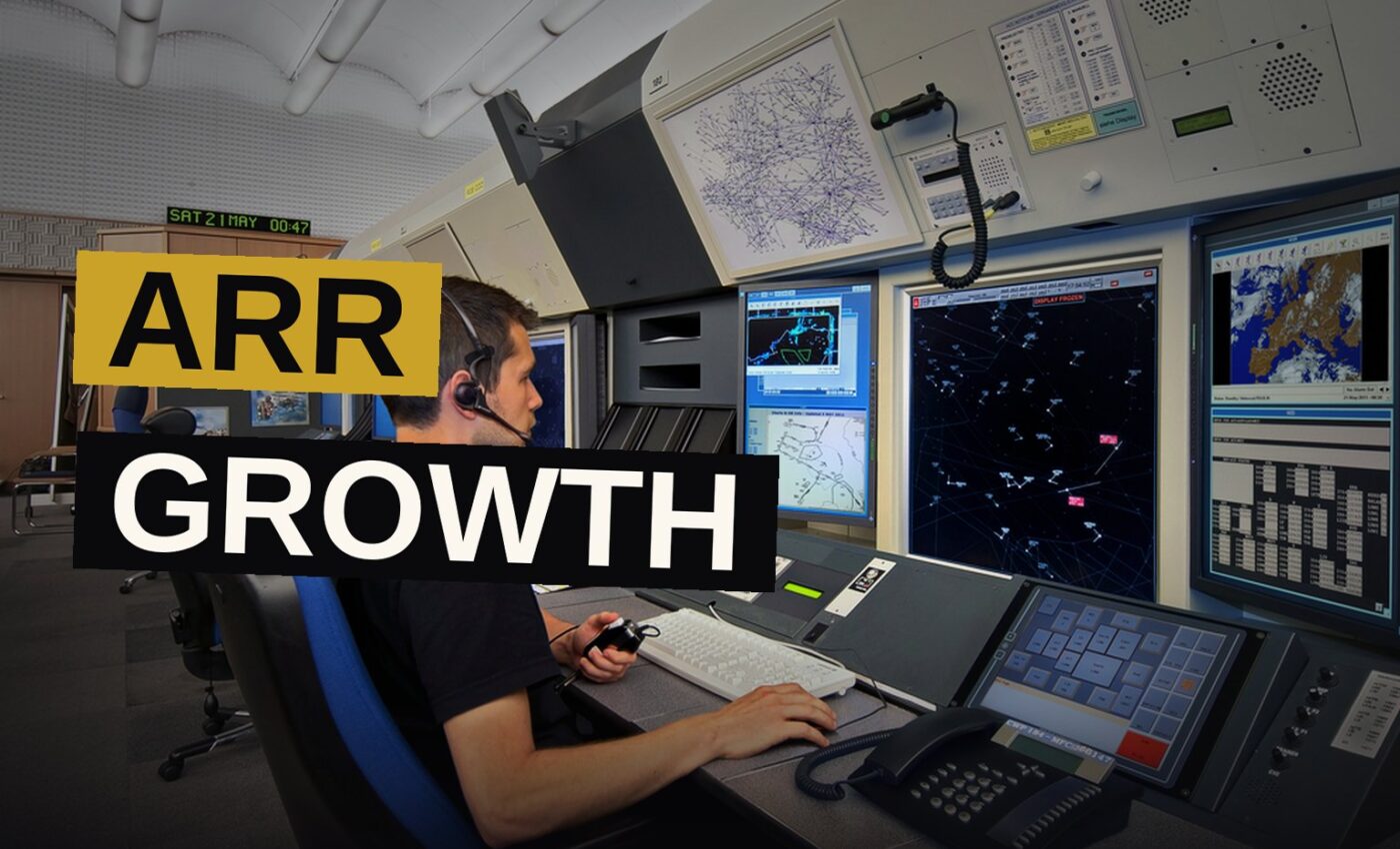 A digital dashboard displaying ARR metrics glows in a modern data center.