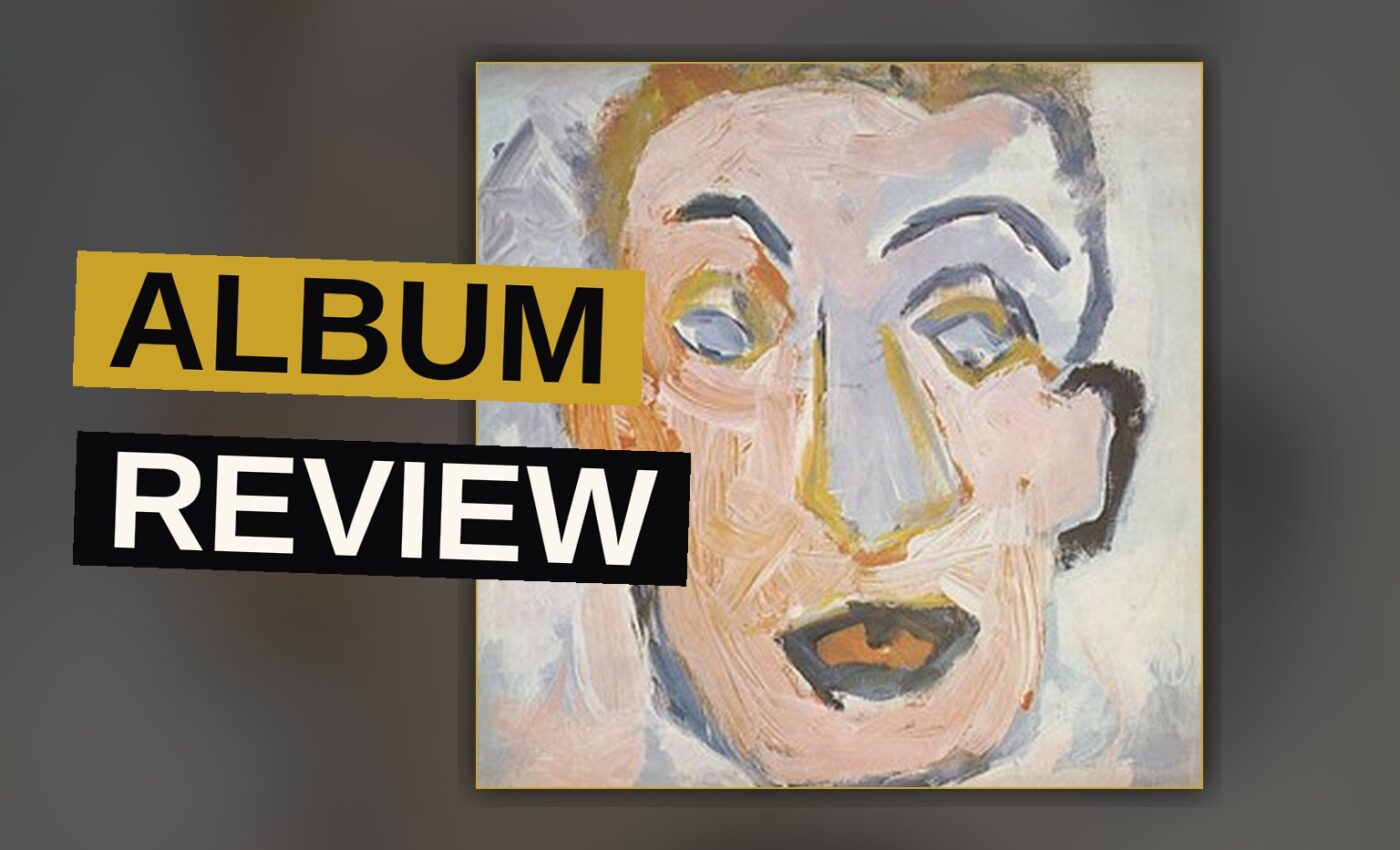 A vinyl record sleeve with a blurred portrait of Bob Dylan in warm amber tones.
