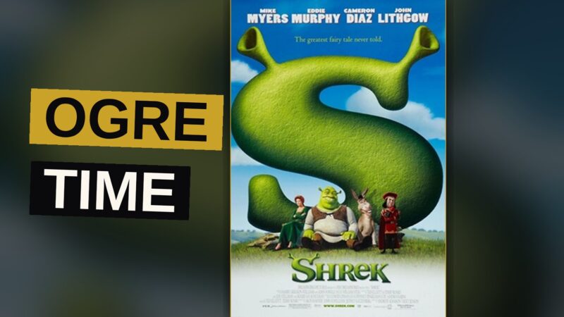 Shrek and Donkey stand together in a swamp at sunset, with Shrek looking annoyed and Donkey smiling.