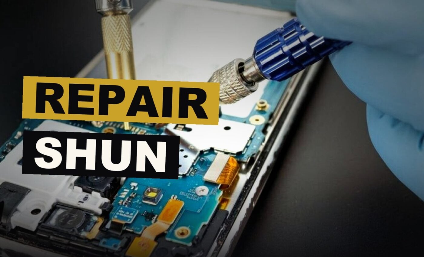 A phone, broken and neglected, rests amid tools its makers seemed unwilling to employ.