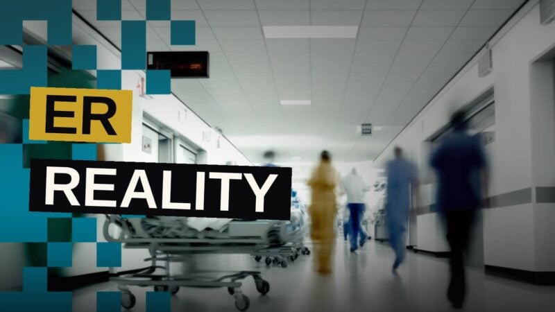 Doctors and nurses move quickly through a crowded, dimly lit emergency room.