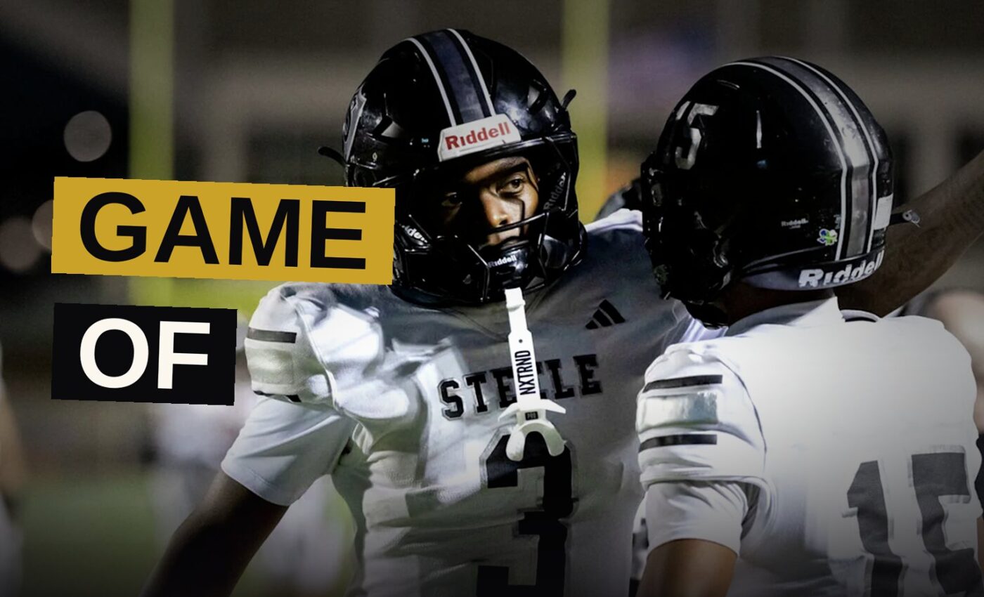 Players line up under stadium lights during a high school football game.