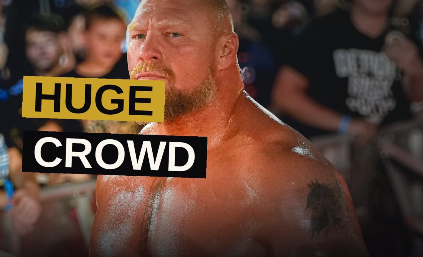 Two wrestlers struggle fiercely within the ring while a multitude watches in rapt attention.