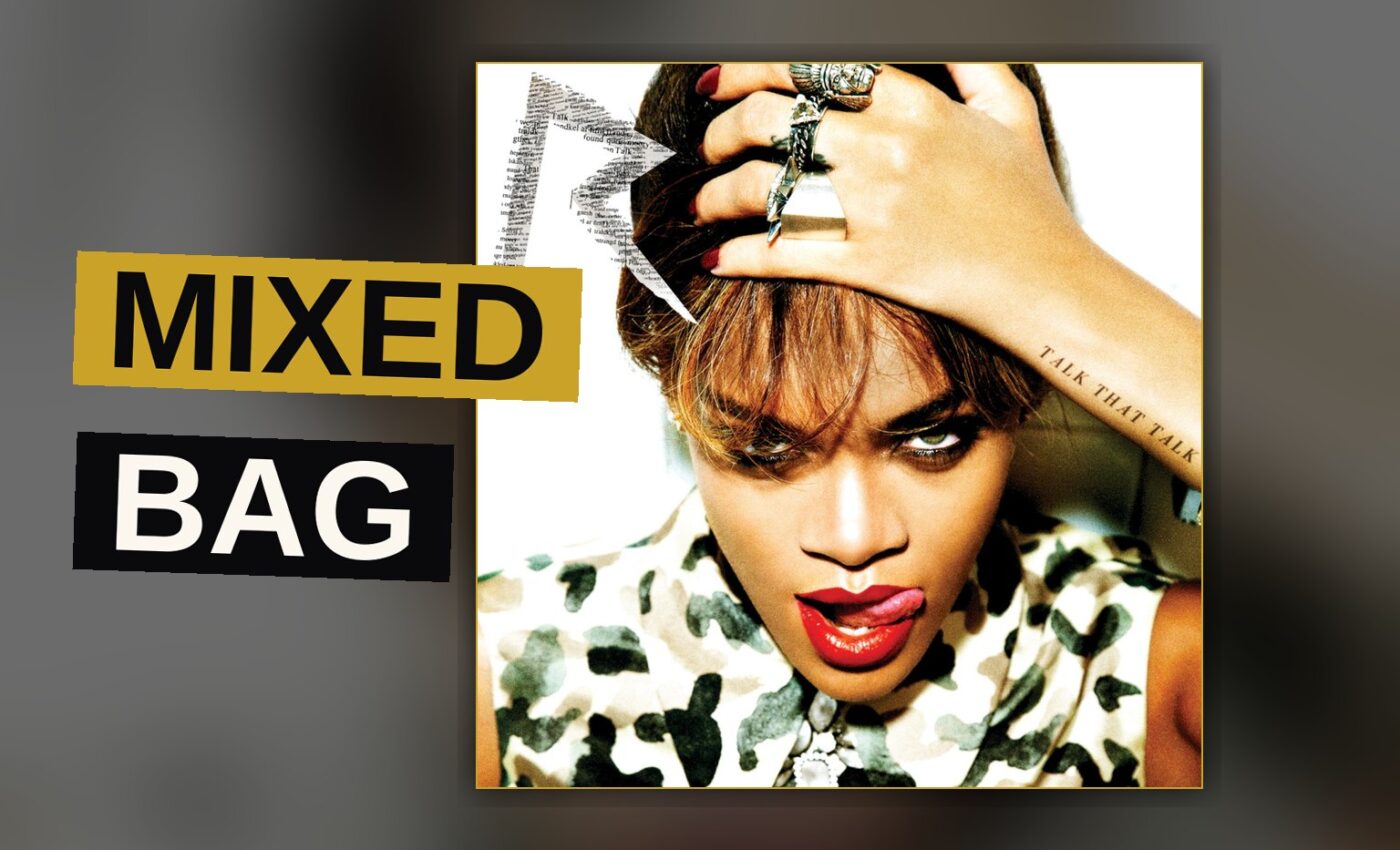 A pop singer performs energetically under bright stage lighting.