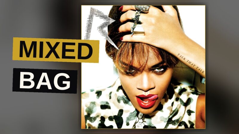 A pop singer performs energetically under bright stage lighting.