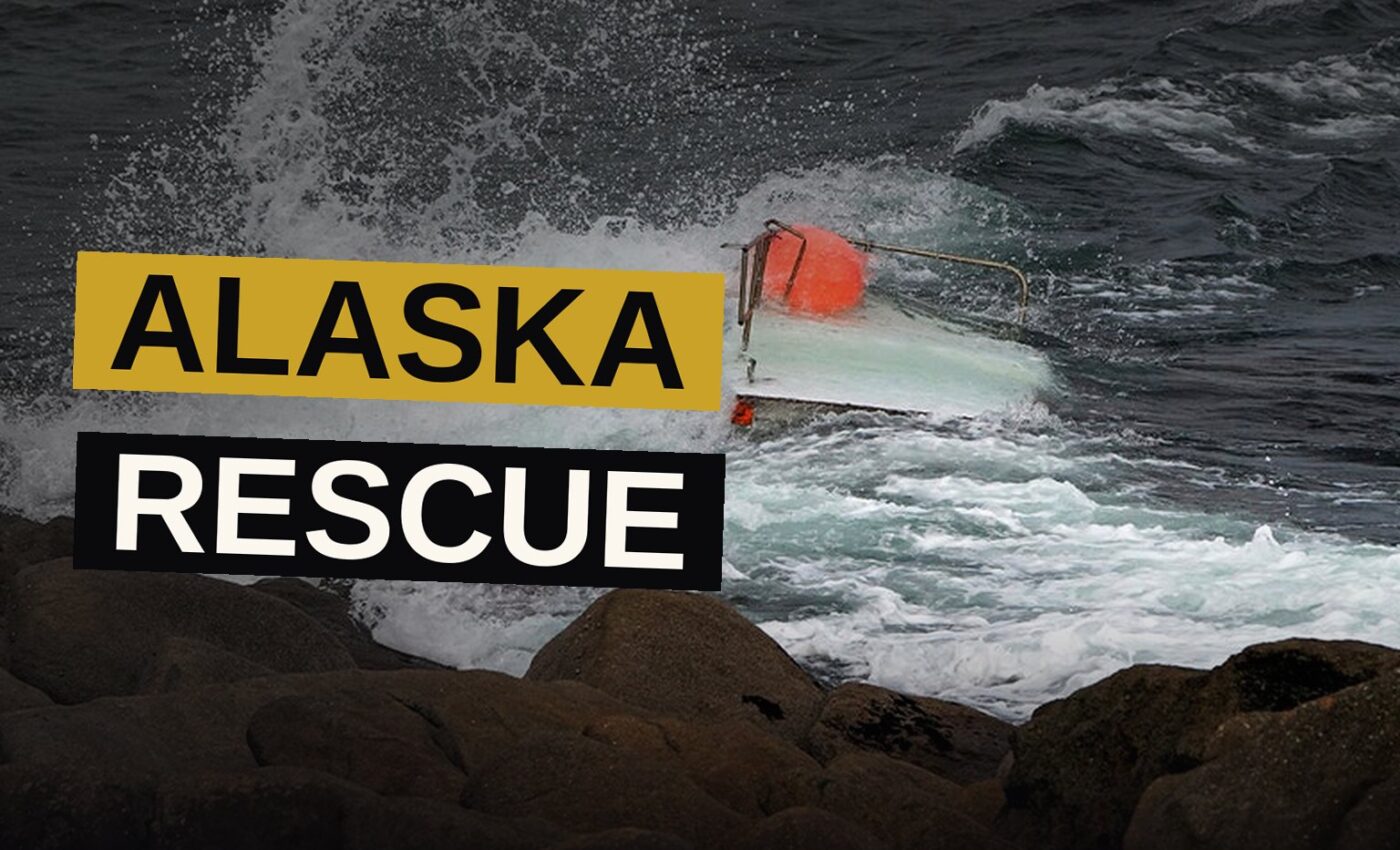 A Coast Guard helicopter hovers over an overturned boat in Alaska waters while a teen clings to the hull.