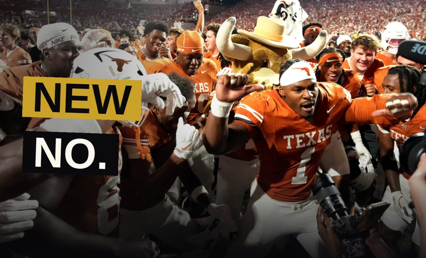 A college football player scores a touchdown under bright stadium lights as fans react.
