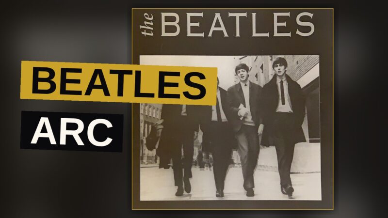 The Beatles walking in sync across a street, captured in black and white with a 1960s feel.