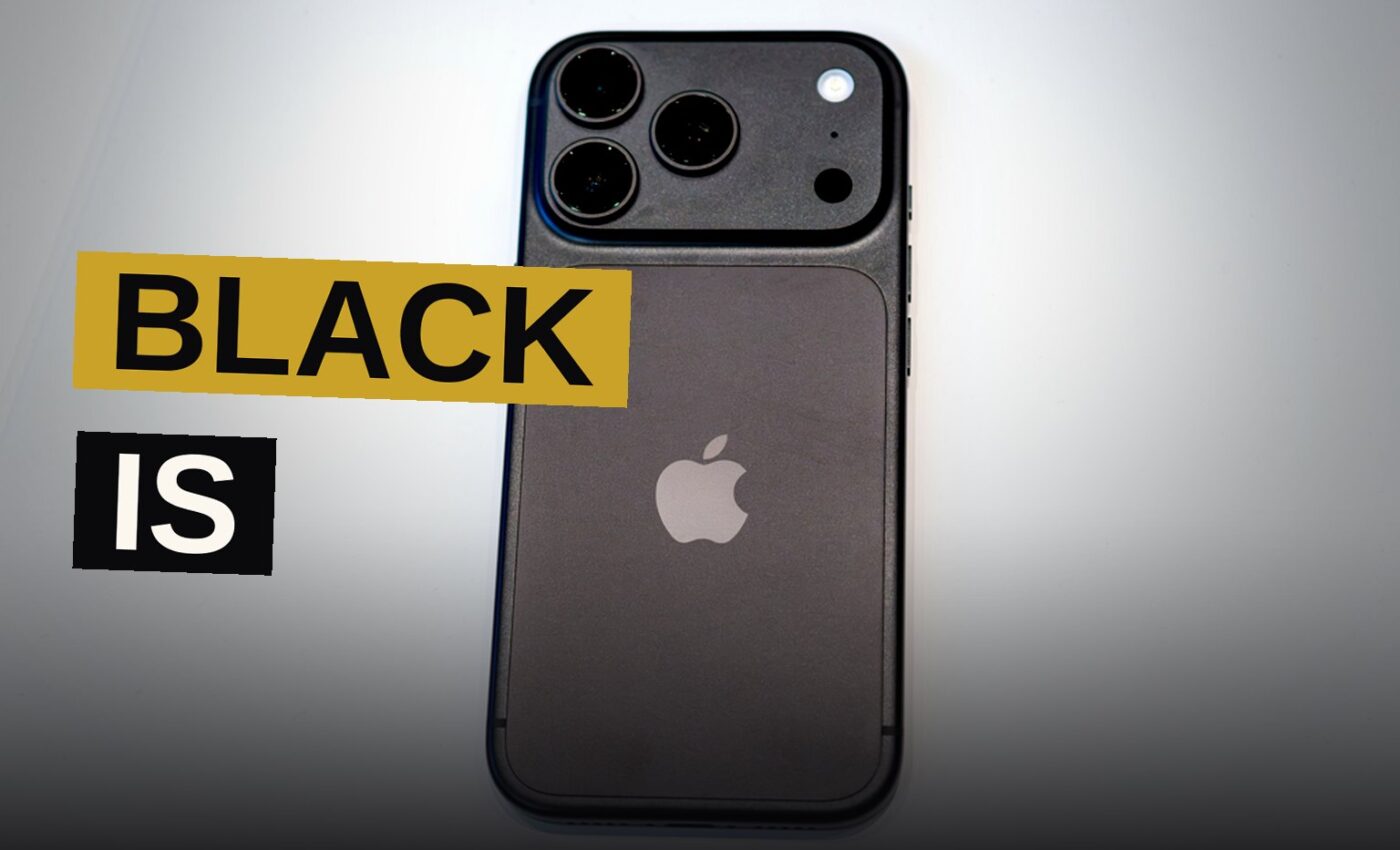 A black iPhone 18 Pro displayed on a dark surface under soft studio lighting.