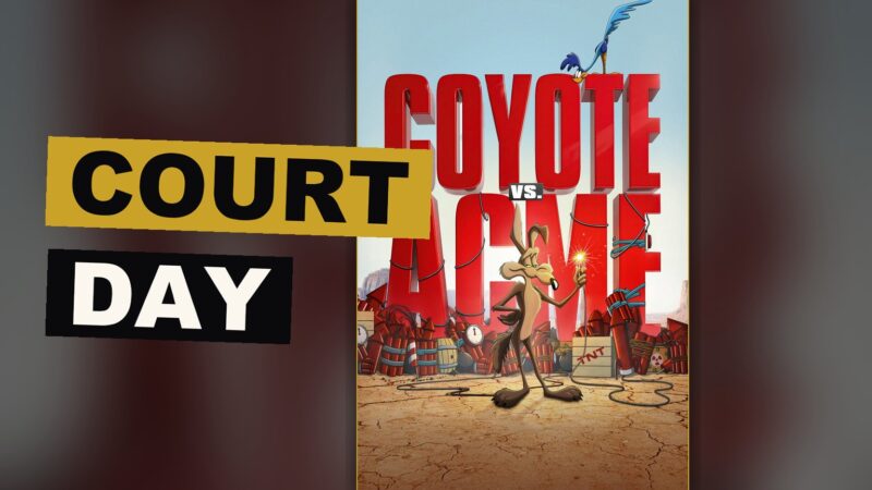 The coyote sits quietly at a court table, caught between his cartoon world and the real one.