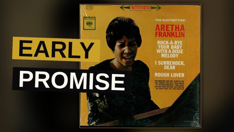 A young Aretha Franklin performs on stage under dramatic spotlight.