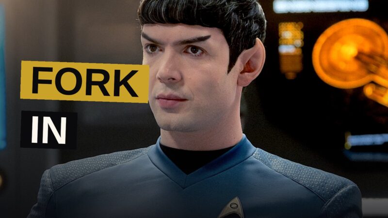 A futuristic starship bridge lit by starlight and glowing navigation displays.