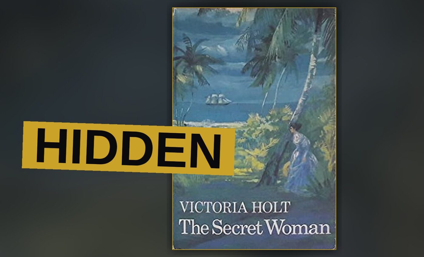 A woman hides in a dim room, fear etched upon her face.