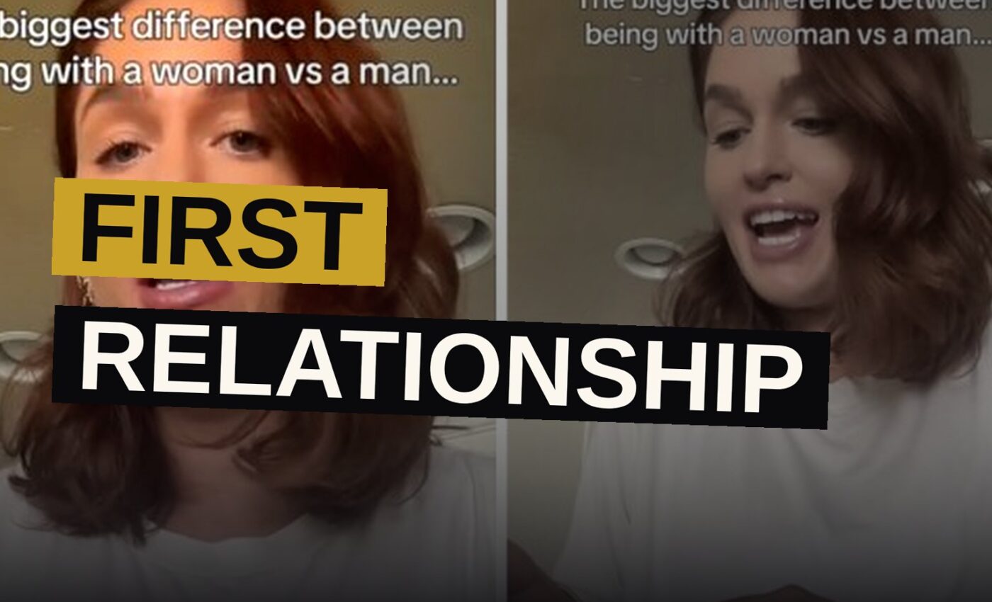 Two women sit closely together on a sofa, sharing an intimate moment.