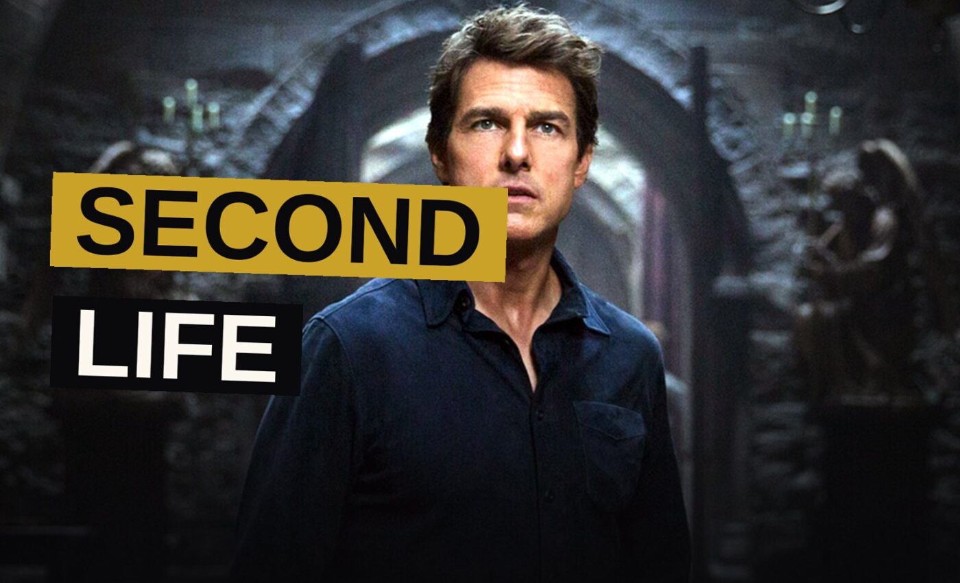 Tom Cruise stands in a dark Egyptian tomb lit by green light, with a mummy's shadow cast behind him.