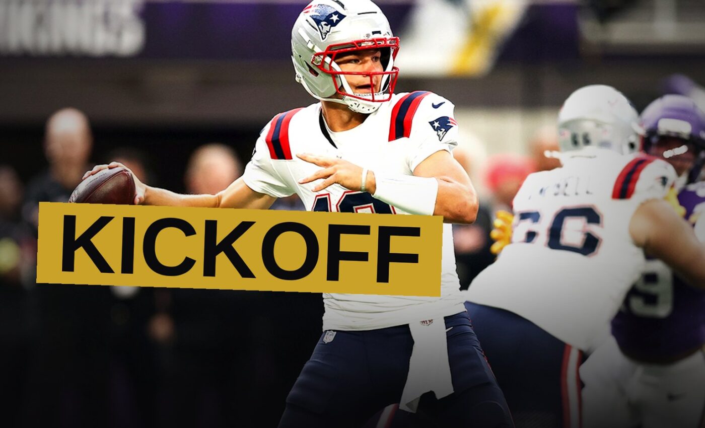 Two NFL teams face off on a brightly lit field at night in a packed stadium.