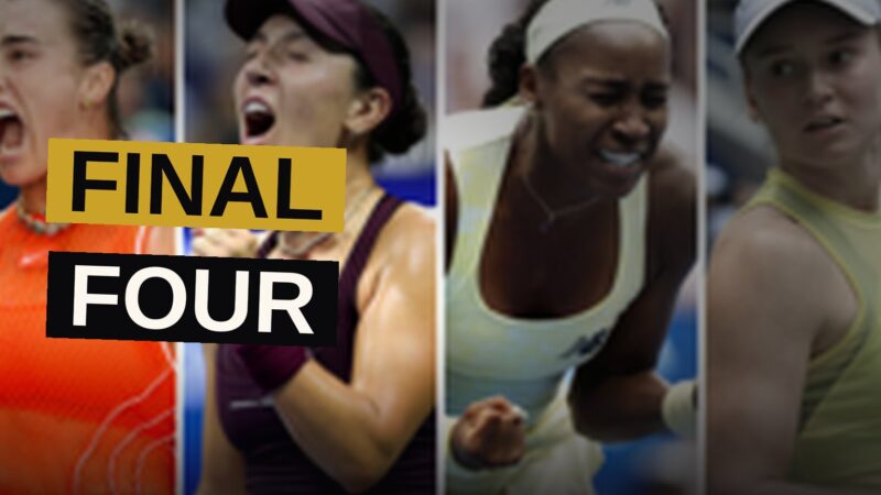 Four women's tennis players stand on a floodlit court under night sky, with a packed stadium in the background.