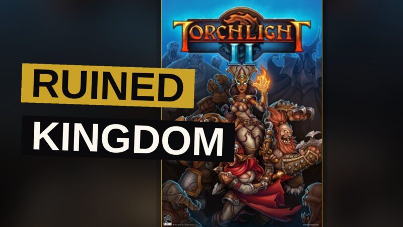 A warrior stands before a ruined castle amid a vast ruined kingdom, torchlight illuminating the scene.