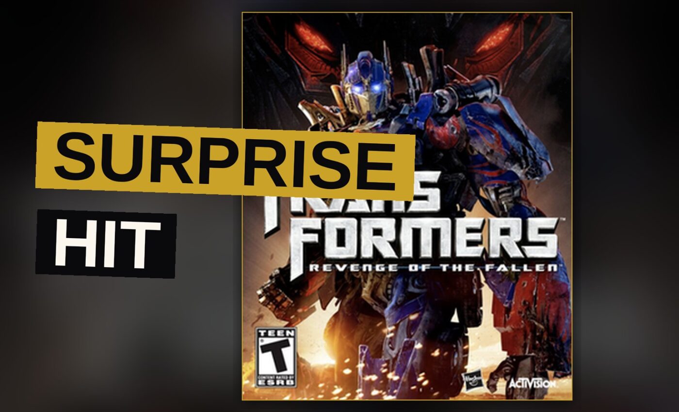 Optimus Prime and Megatron clash in a desert battlefield with explosions.