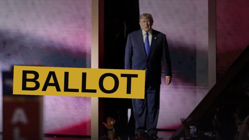 Donald Trump speaks at a podium before a large crowd at a GOP convention in a Dallas arena.