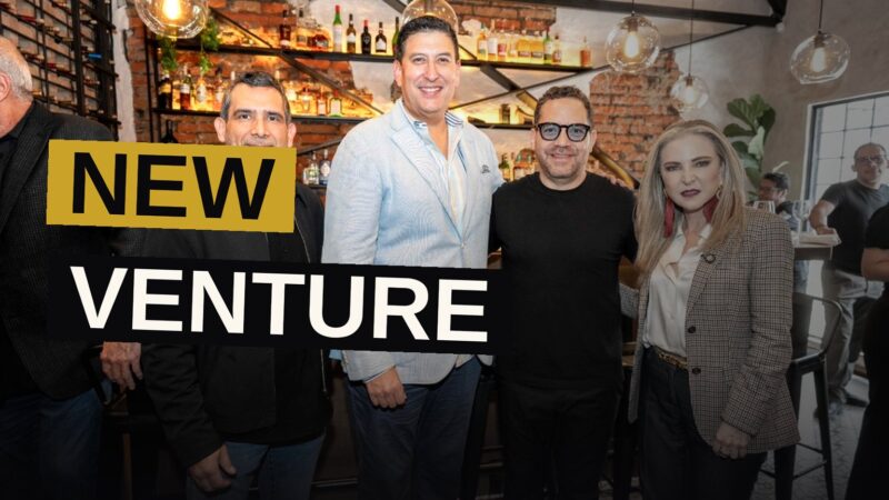 A dimly lit recording studio with mixing equipment representing a new Ecuadorian music venture.