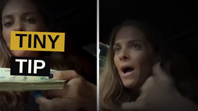 A waitress in a diner holds a receipt and a few dollar bills, looking disappointed.