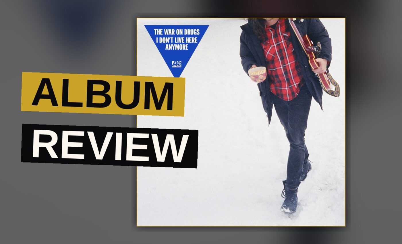 A vinyl record spins under warm light, evoking the mood of a reflective album.