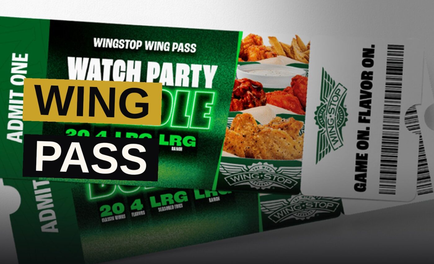 An overhead view of a Wingstop Watch Party Bundle with wings, fries, and ranch on a football-themed table.