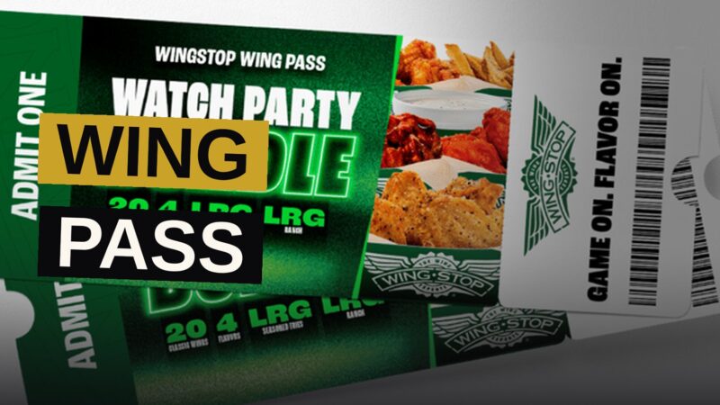 An overhead view of a Wingstop Watch Party Bundle with wings, fries, and ranch on a football-themed table.