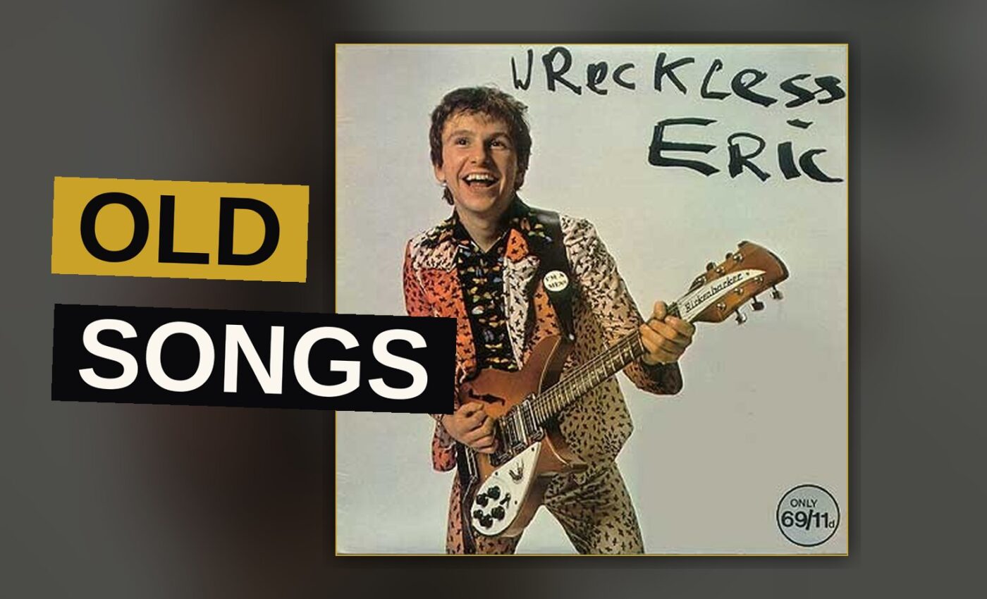 A vinyl record spins beneath warm light, evoking a classic British rock album.