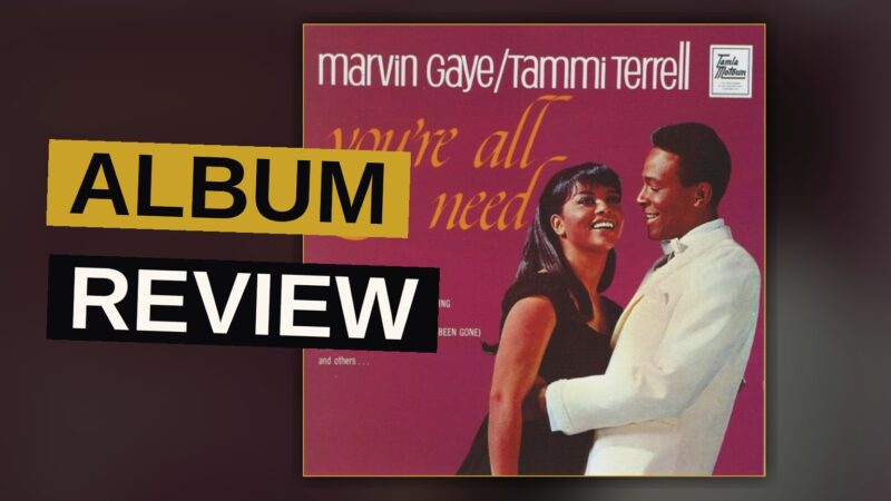 Marvin Gaye and Tammi Terrell smiling together in a warm, vintage studio portrait.
