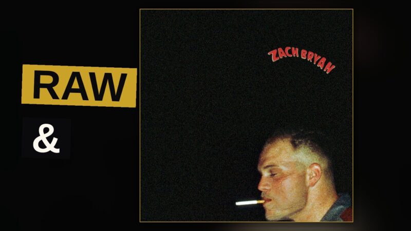 An acoustic guitar rests against a sunlit porch railing, evoking the rustic Americana feel of Zach Bryan's music.